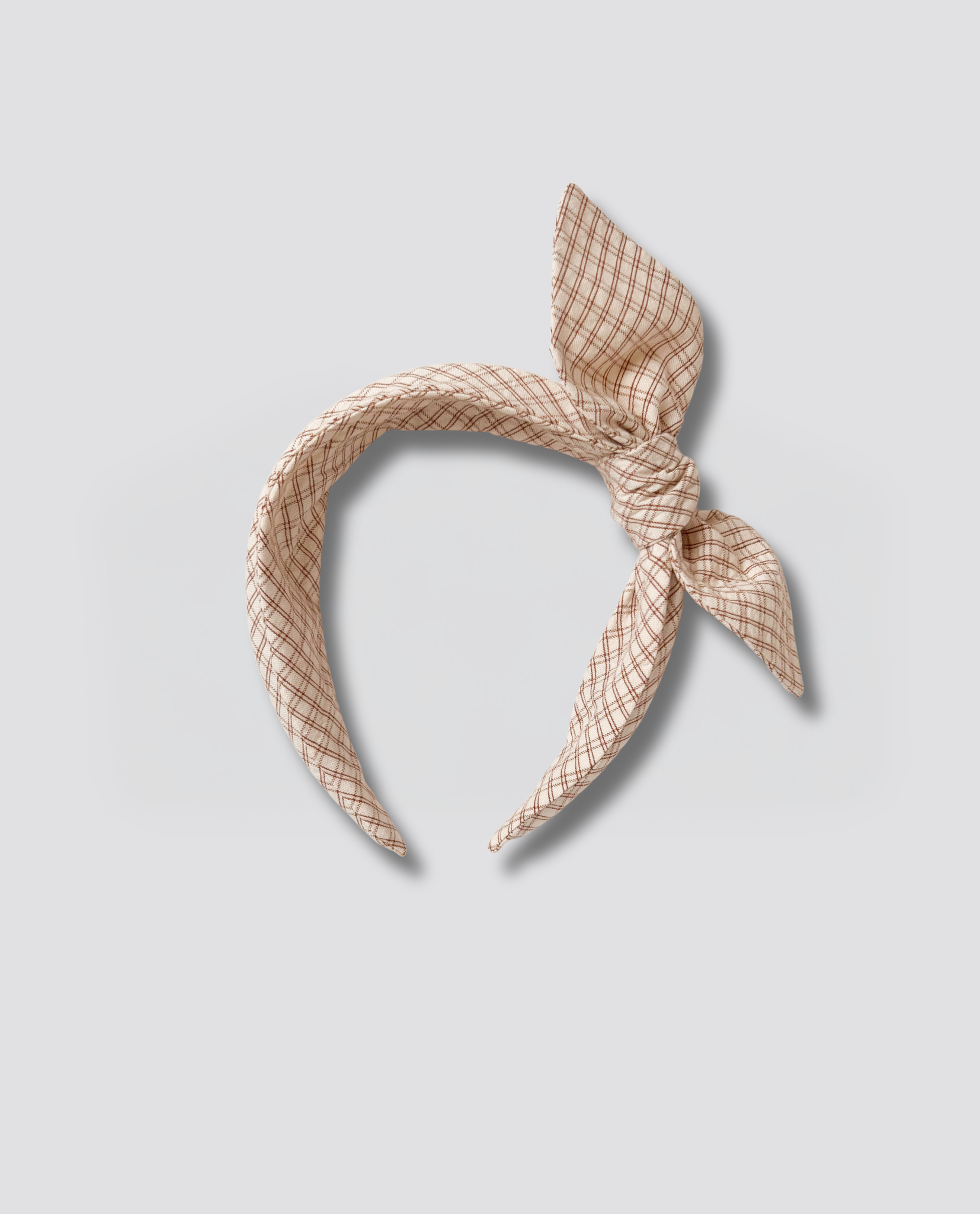 Wide retro style children's hairband in a soft straw check pattern, made from natural materials for a vintage, organic look with ethical craftsmanship.