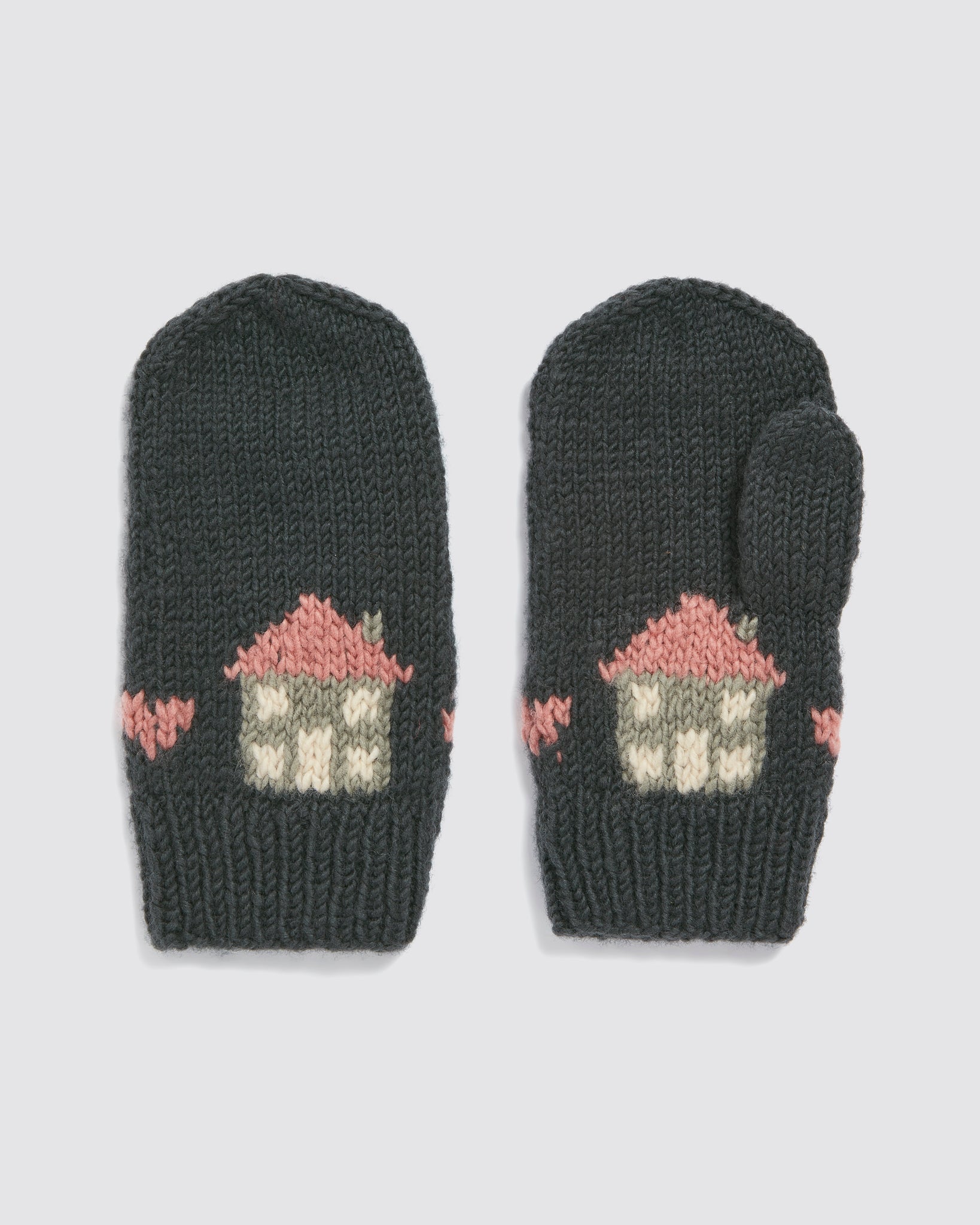 Pair of hand-knitted multicolor merino mittens for kids with charming vintage-style house pattern, made from natural materials in a sustainable and ethical process.