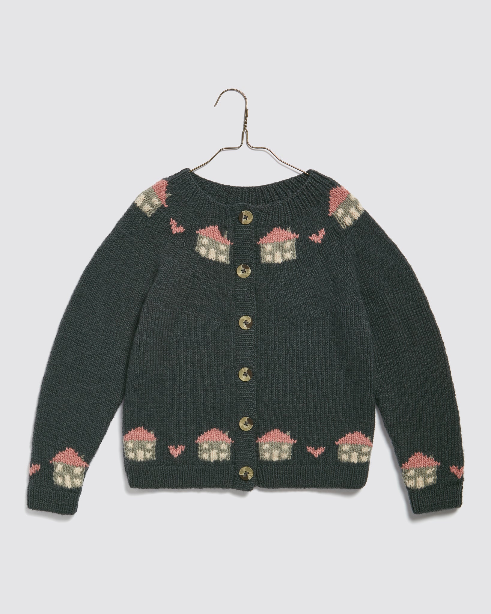 Hand-knitted kids cardigan in blue merino wool with a charming vintage-style cottage pattern, made from natural, sustainable materials for ethical children's clothing.