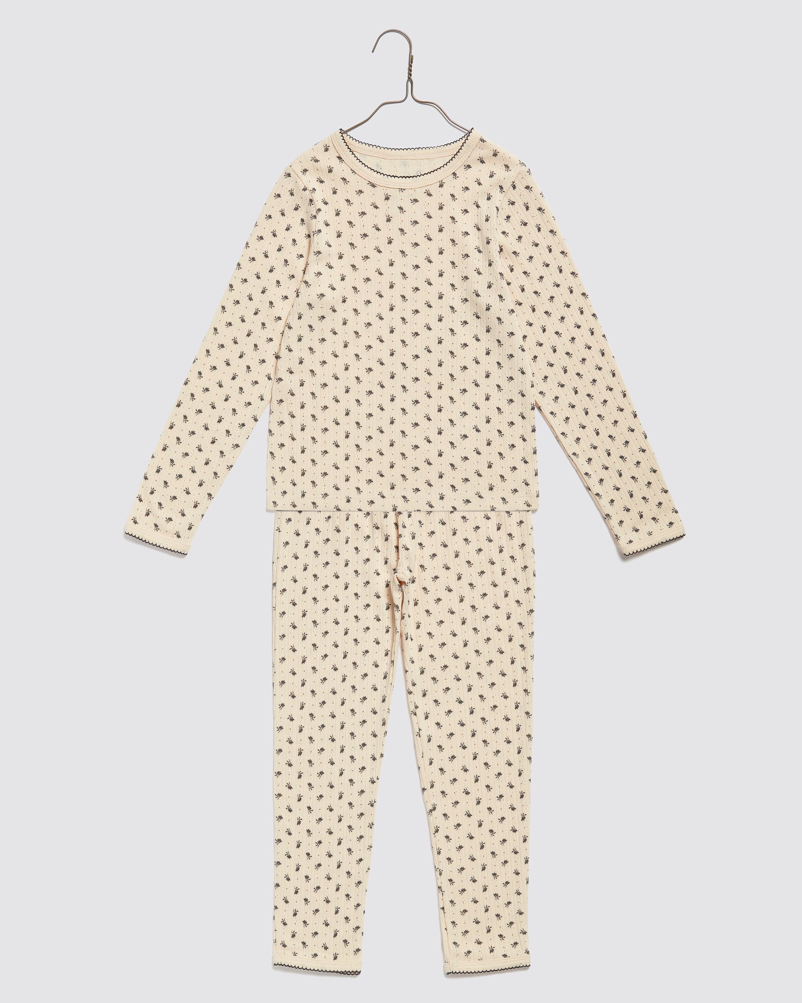 Soft organic cotton children’s pyjama set with delicate ditsy floral print in vintage style, designed for comfort and ethical, sustainable wear.