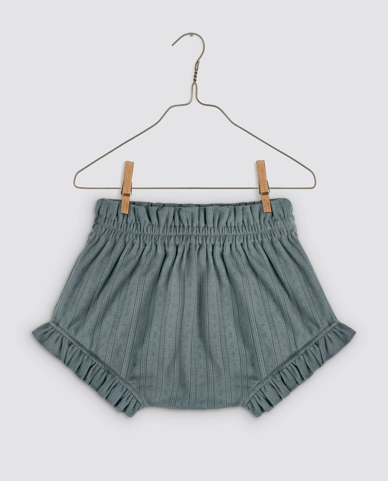 Slate blue cotton bloomers with delicate pointelle detailing and ruffled edges, designed for sustainable and vintage-inspired children's clothing.