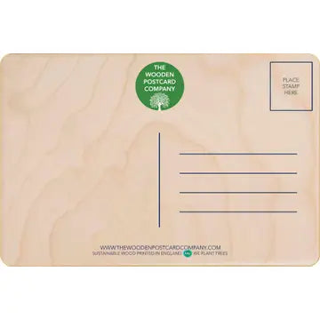 Back of a natural wooden postcard with a green logo, featuring simple vintage-style design and space for a stamp and address lines.