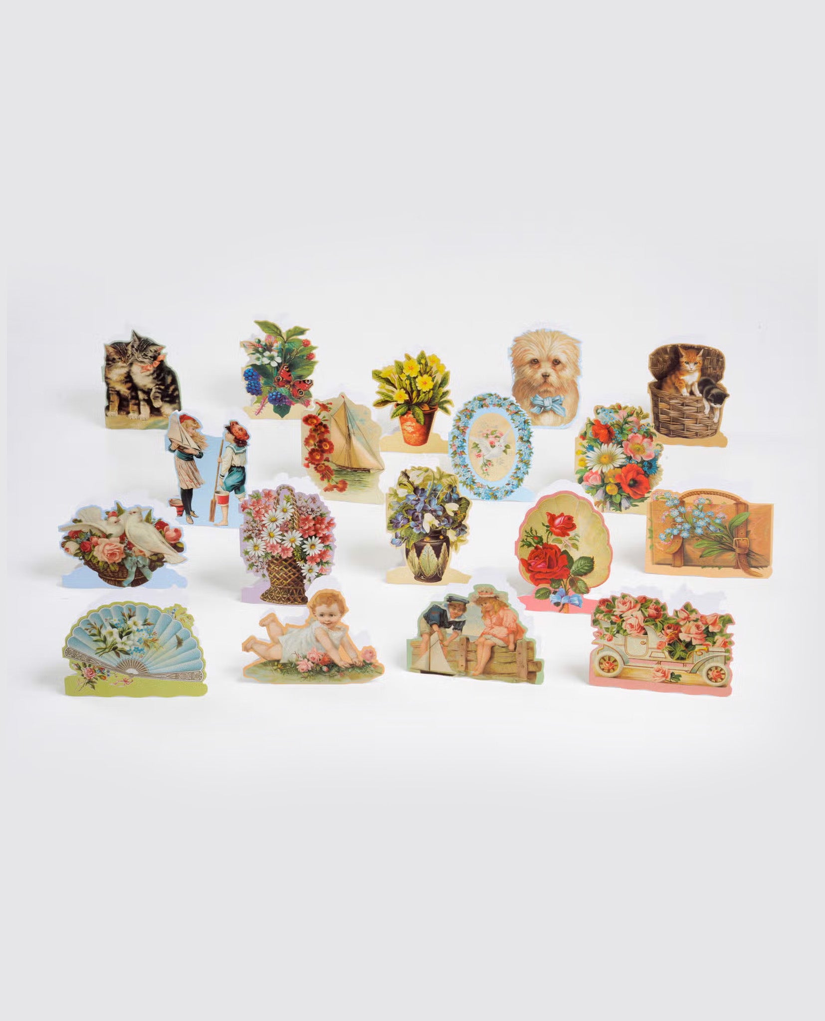 A collection of vintage style decorative note cards featuring illustrations of animals, flowers, children, and nostalgic scenes, evoking a slow, natural and ethical aesthetic.