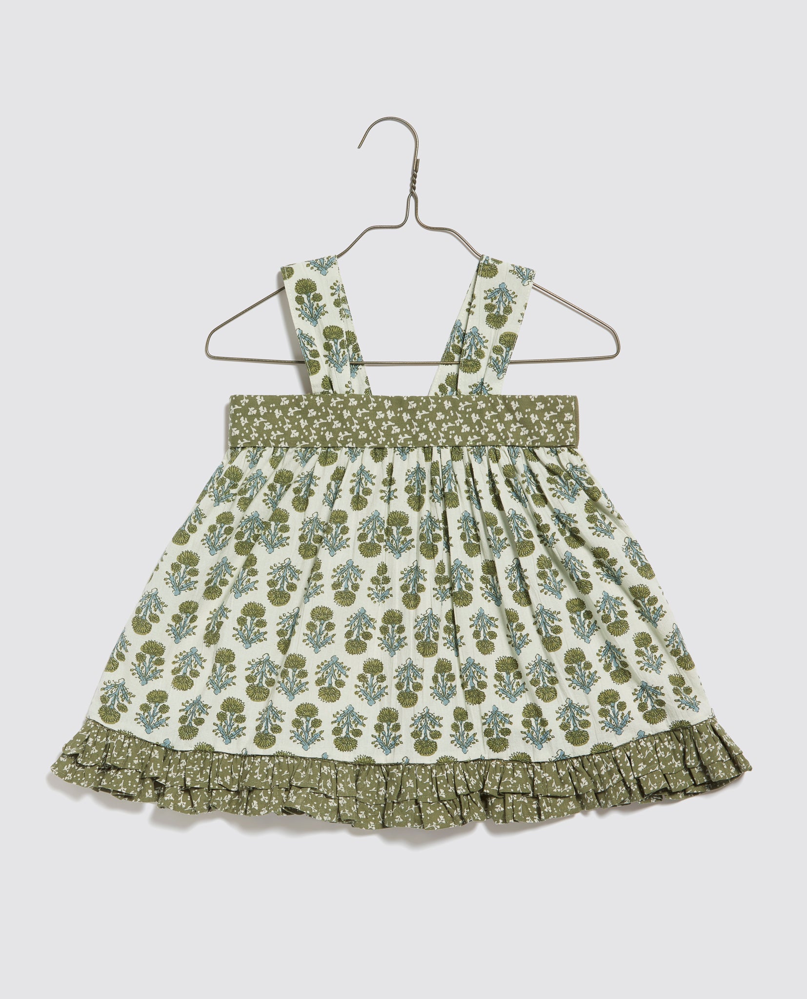Vintage style girls sun top with green floral print and ruffled hem, made from organic cotton for sustainable and ethical children's clothing.