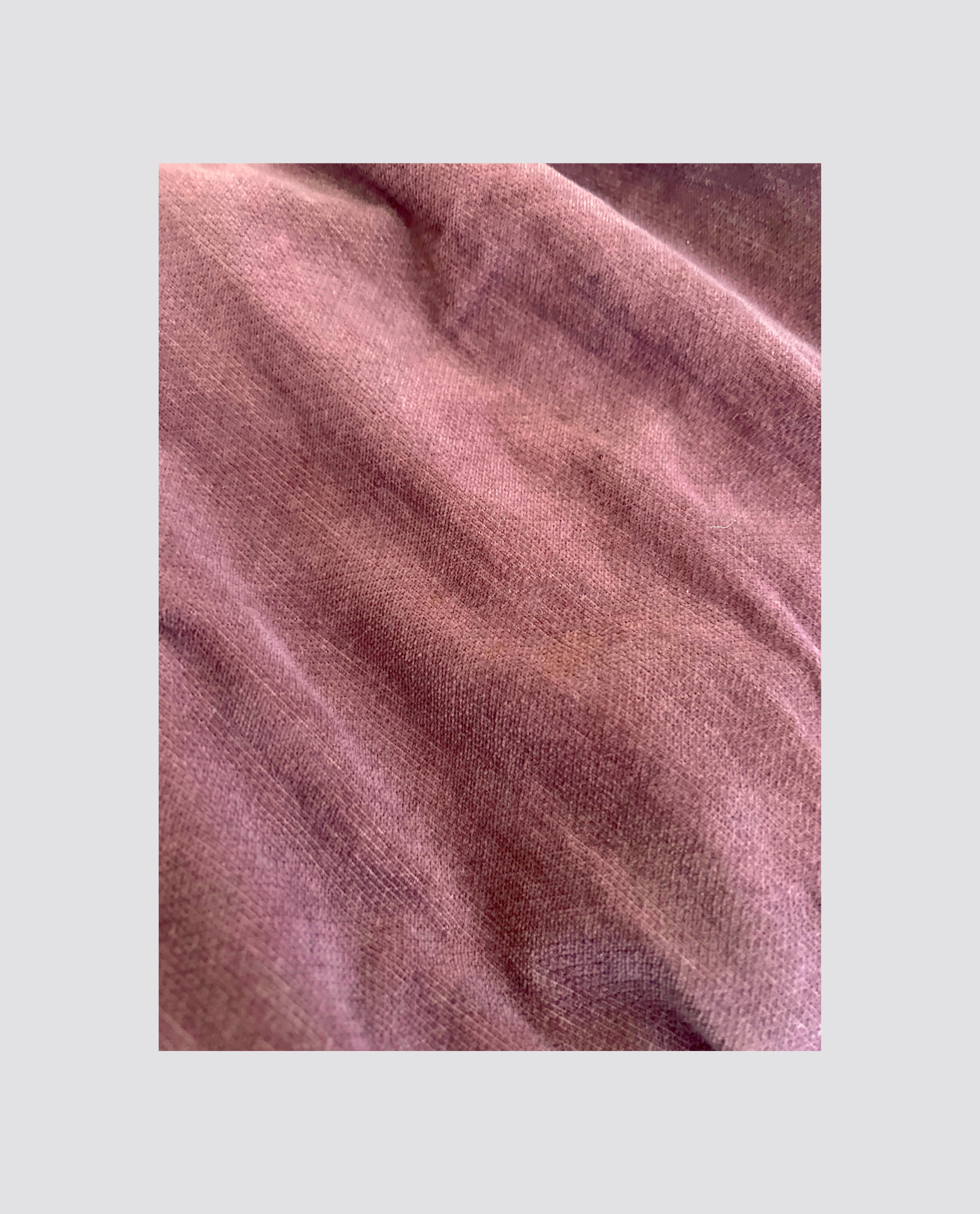 Close-up of soft nutmeg brown organic cotton velvet fabric with a smooth texture, ideal for creating natural, vintage-style children's clothing.