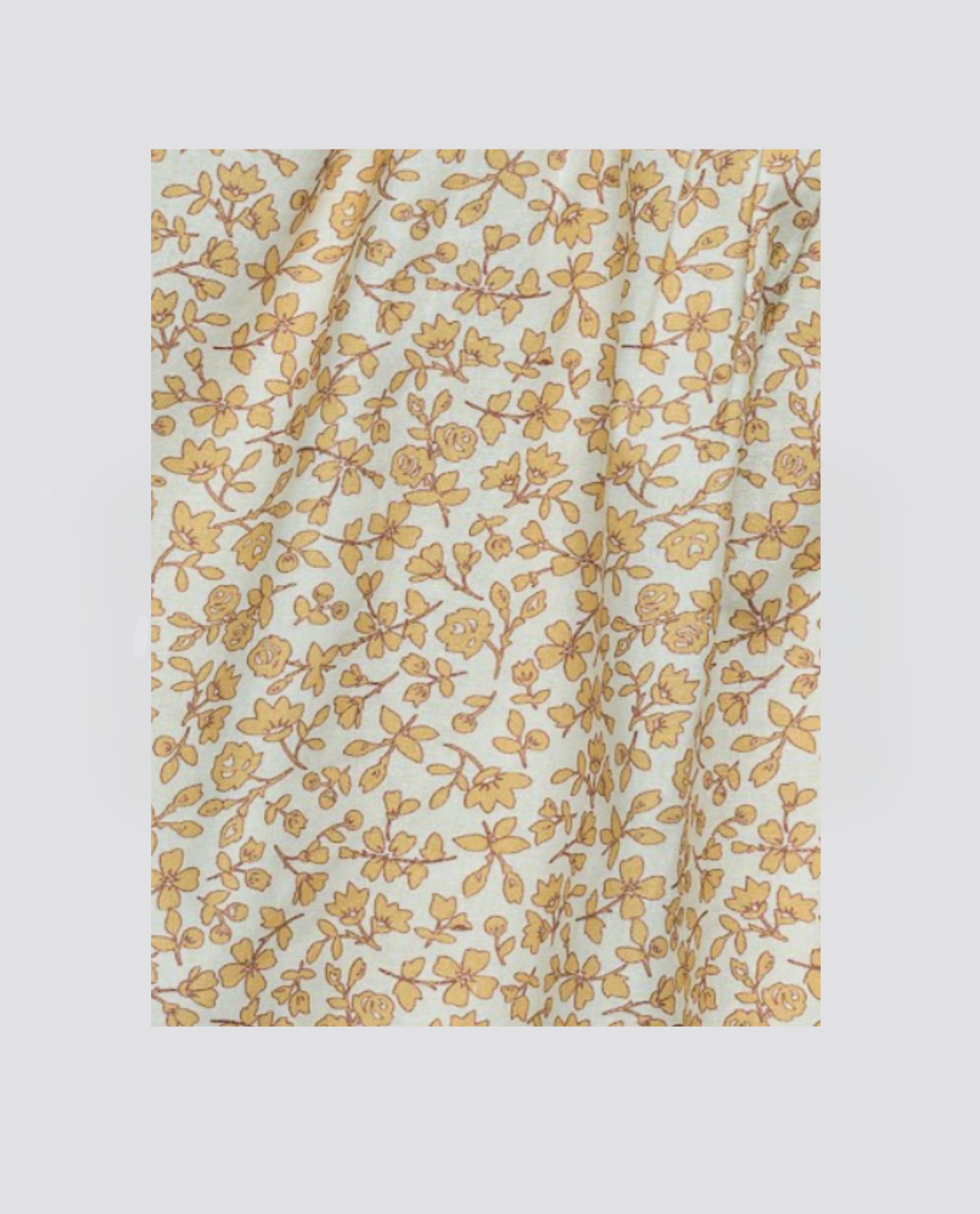 Yellow floral pattern on organic cotton fabric, featuring delicate vintage-style flowers and leaves, perfect for sustainable children's clothing and dress making.