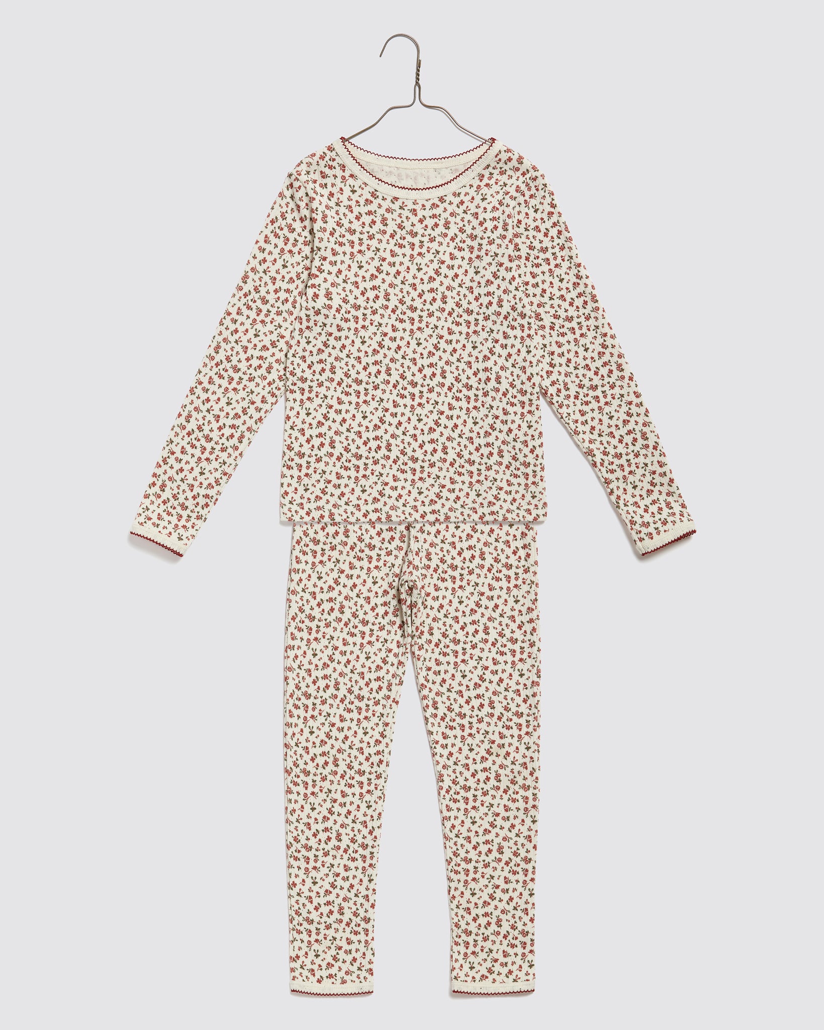 Long-sleeve organic jersey cotton pyjamas for kids with a delicate posy floral print, featuring a soft vintage-inspired design in sustainable, ethically made children's clothing.
