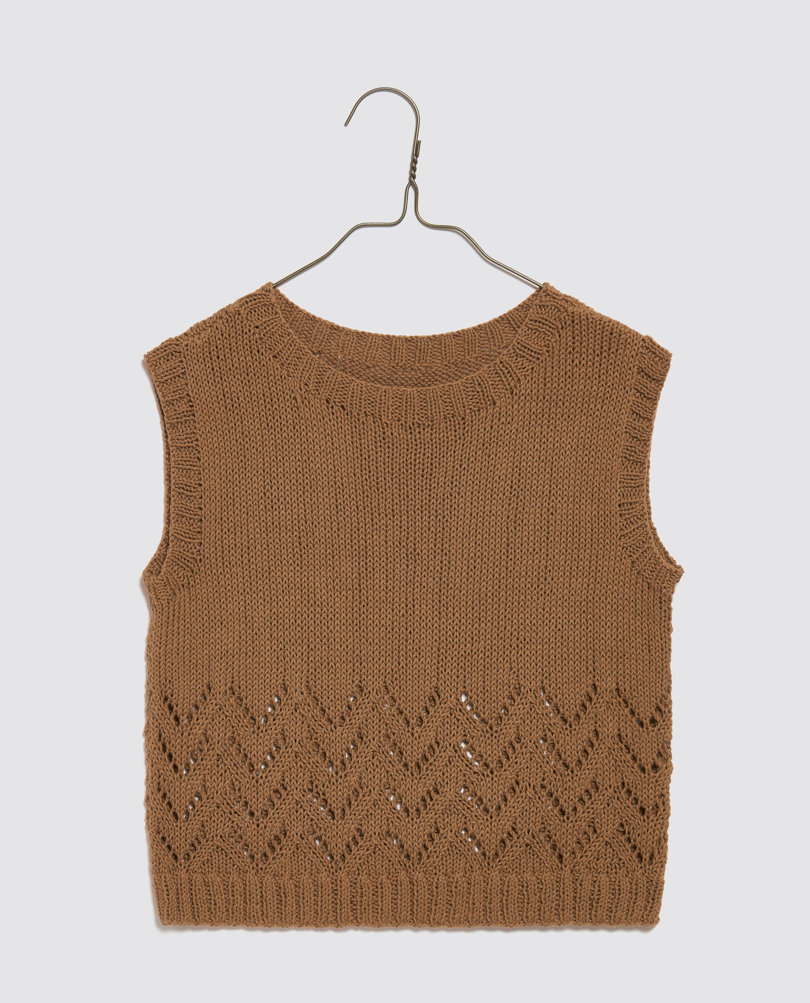 Toffee-colored hand-knitted cotton tank top for kids featuring an openwork pattern, made with organic, natural materials in a vintage style for sustainable children's clothing.