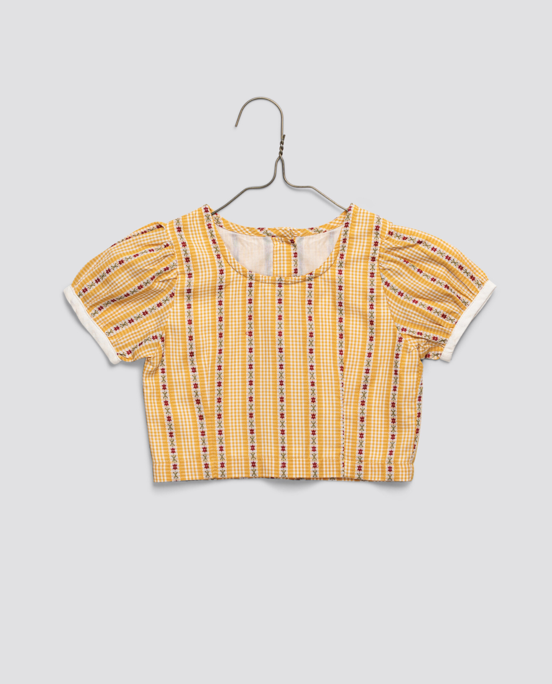 Yellow floral patterned girls blouse made from organic cotton with a vintage-inspired design, perfect for sustainable and ethically made children's clothing.
