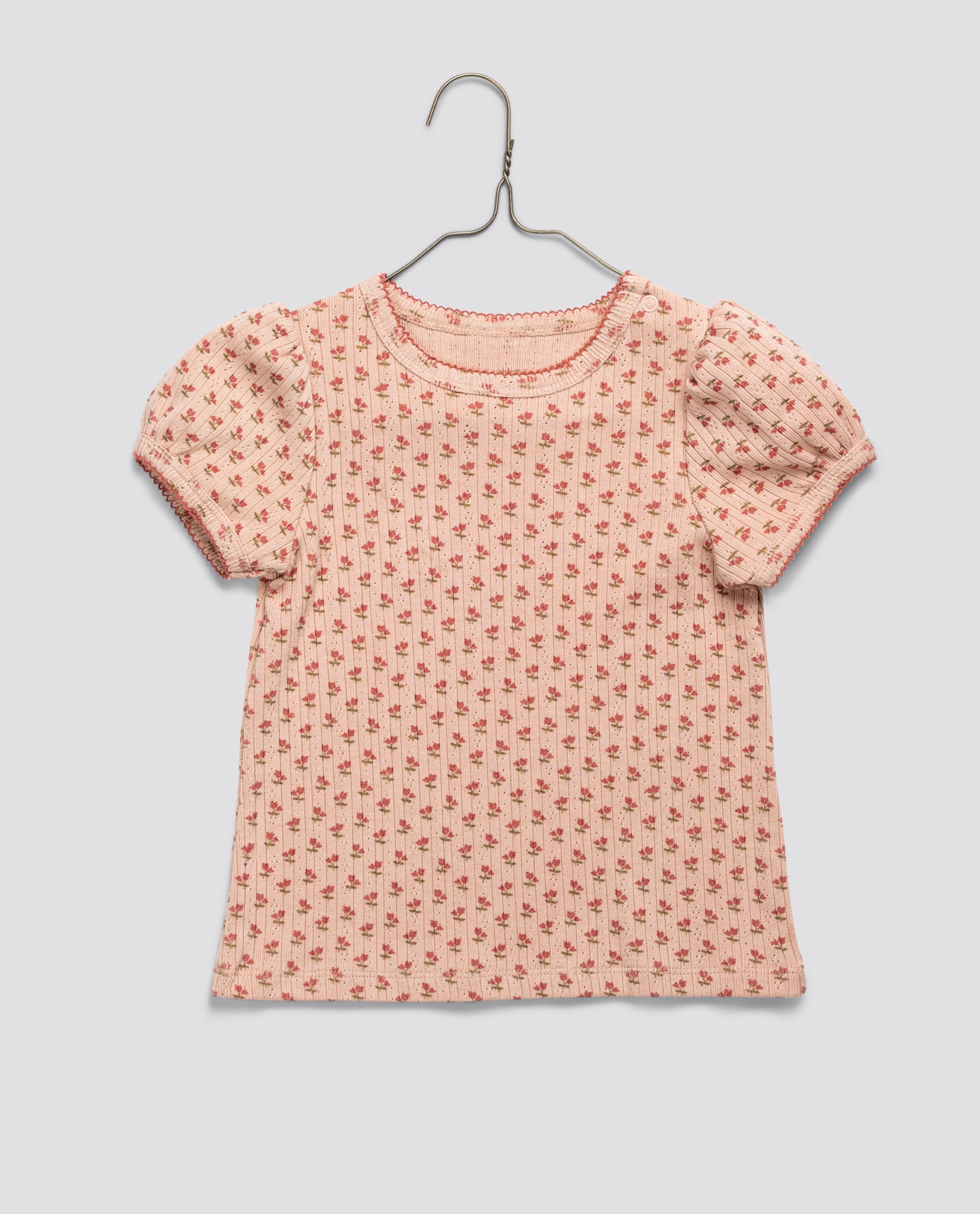 Pink organic jersey cotton girls blouse with tulip floral pattern and puff sleeves, featuring a vintage-inspired sustainable design for natural, ethical children's clothing.