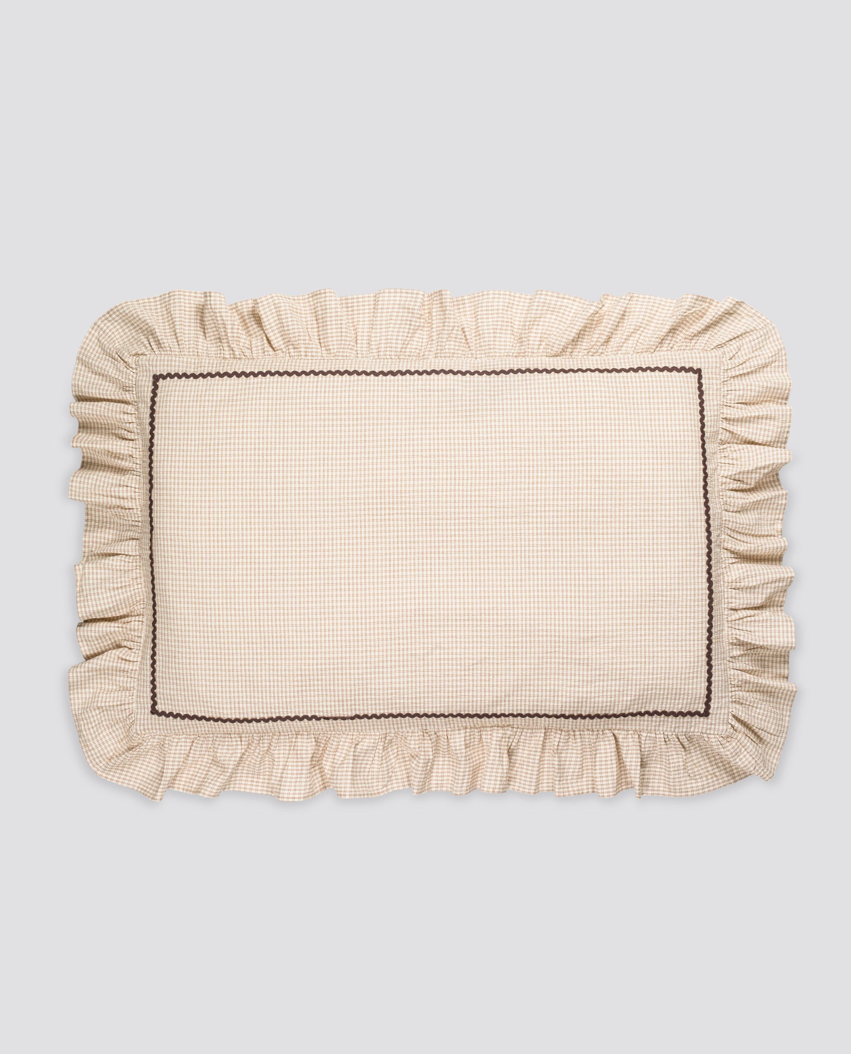 Vintage style organic cotton pillowcase with a delicate straw check pattern and ruffled edges, reflecting traditional, sustainable, and ethically made children’s bedding.