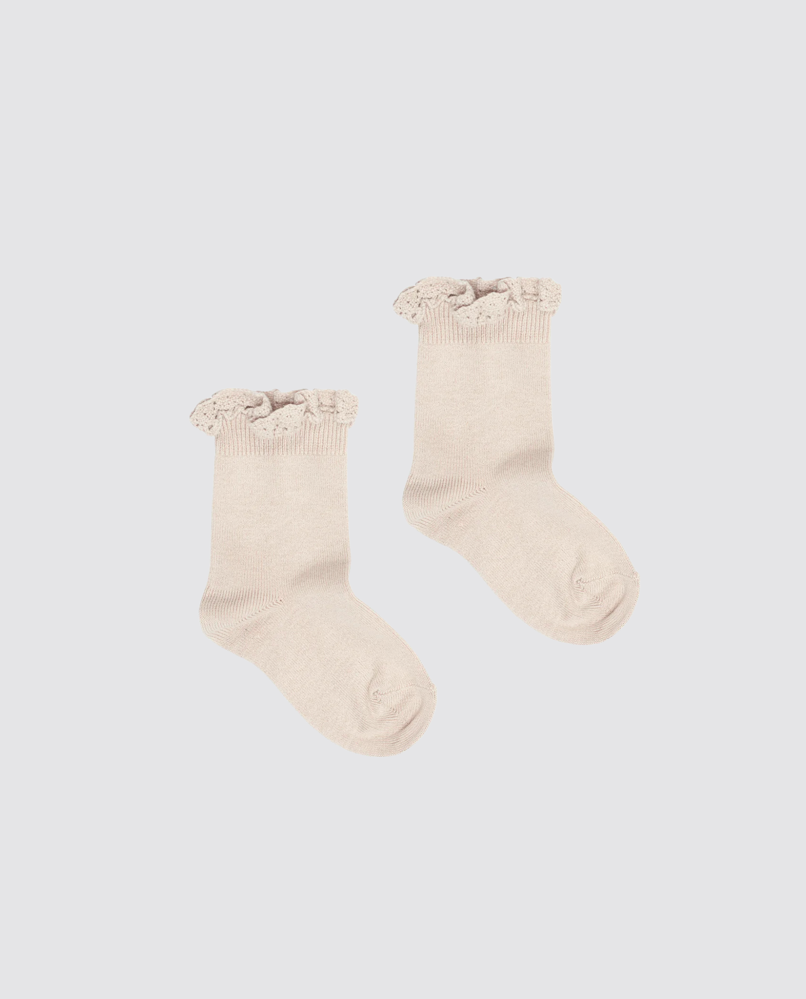 Beige ankle socks for kids made from a soft cotton blend, featuring delicate lace frill cuffs in a vintage-inspired, sustainable design.