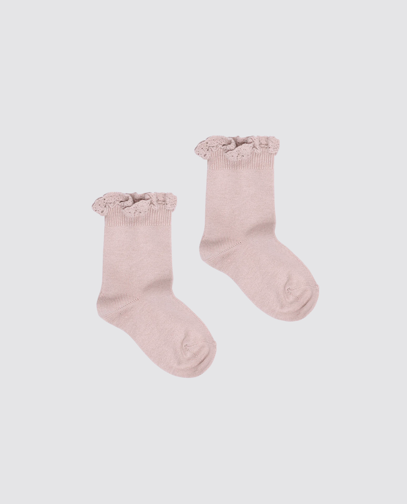 Soft pink cotton blend ankle socks for kids featuring delicate lace frill trim, designed with a vintage style and made using sustainable, natural materials.