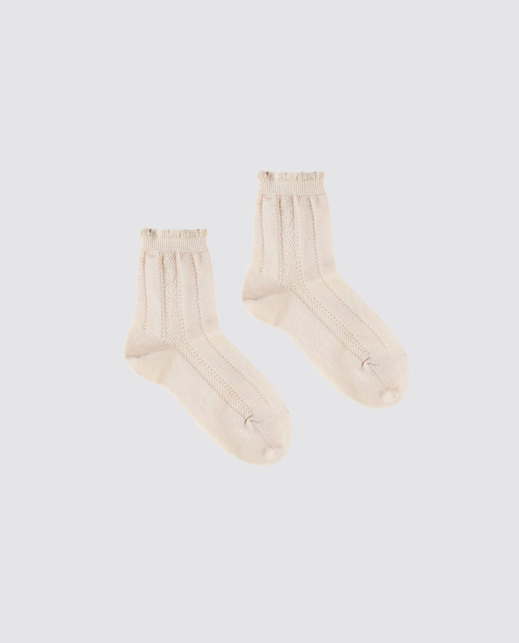 Beige kids ankle socks with delicate knit patterns and frilled edges, made from a soft cotton blend, perfect for vintage-inspired sustainable children's clothing.