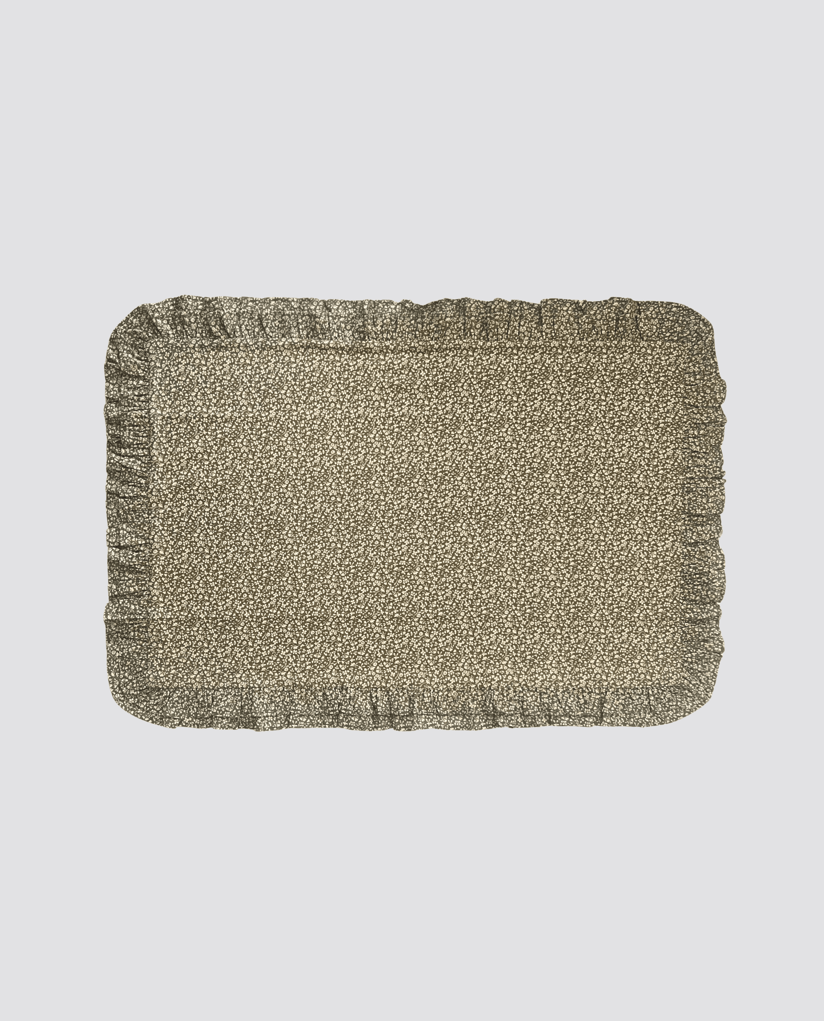 Soft organic cotton pillowcase in a green floral pattern with delicate frilly edges, combining vintage style with sustainable, natural materials for a gentle touch.