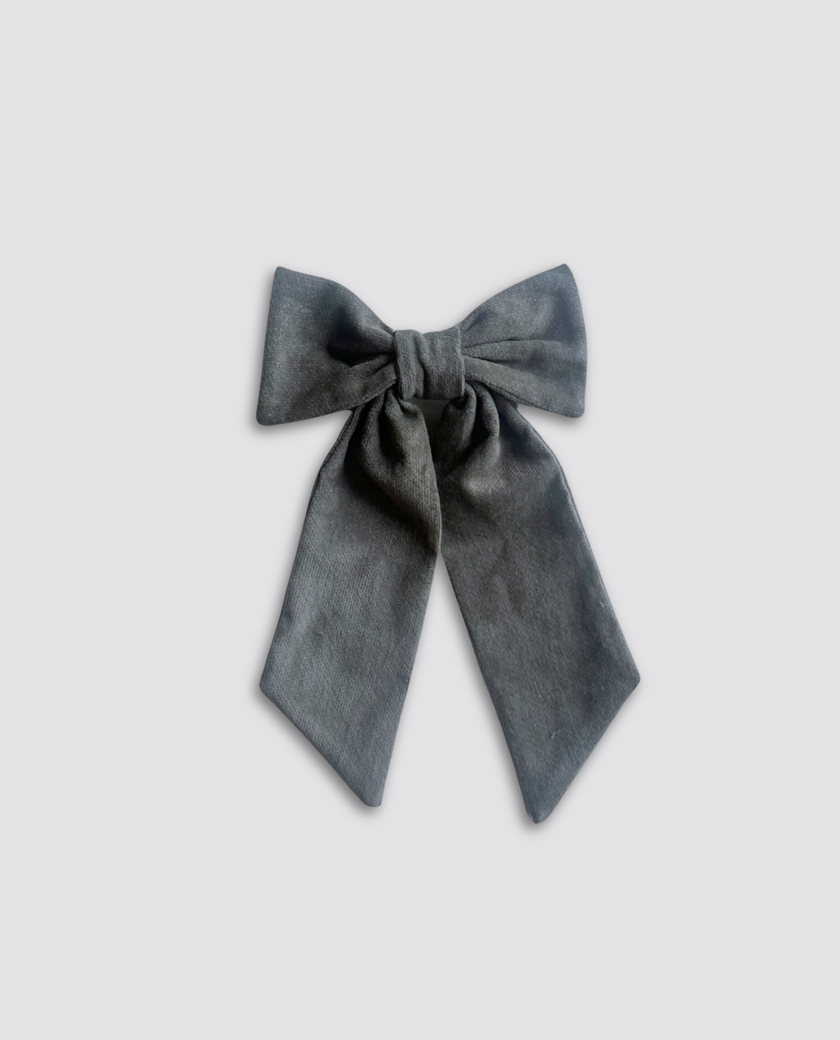 Navy blue velvet bow clip made from soft natural velvet, perfect for vintage style children's clothing with an ethical and sustainable focus.