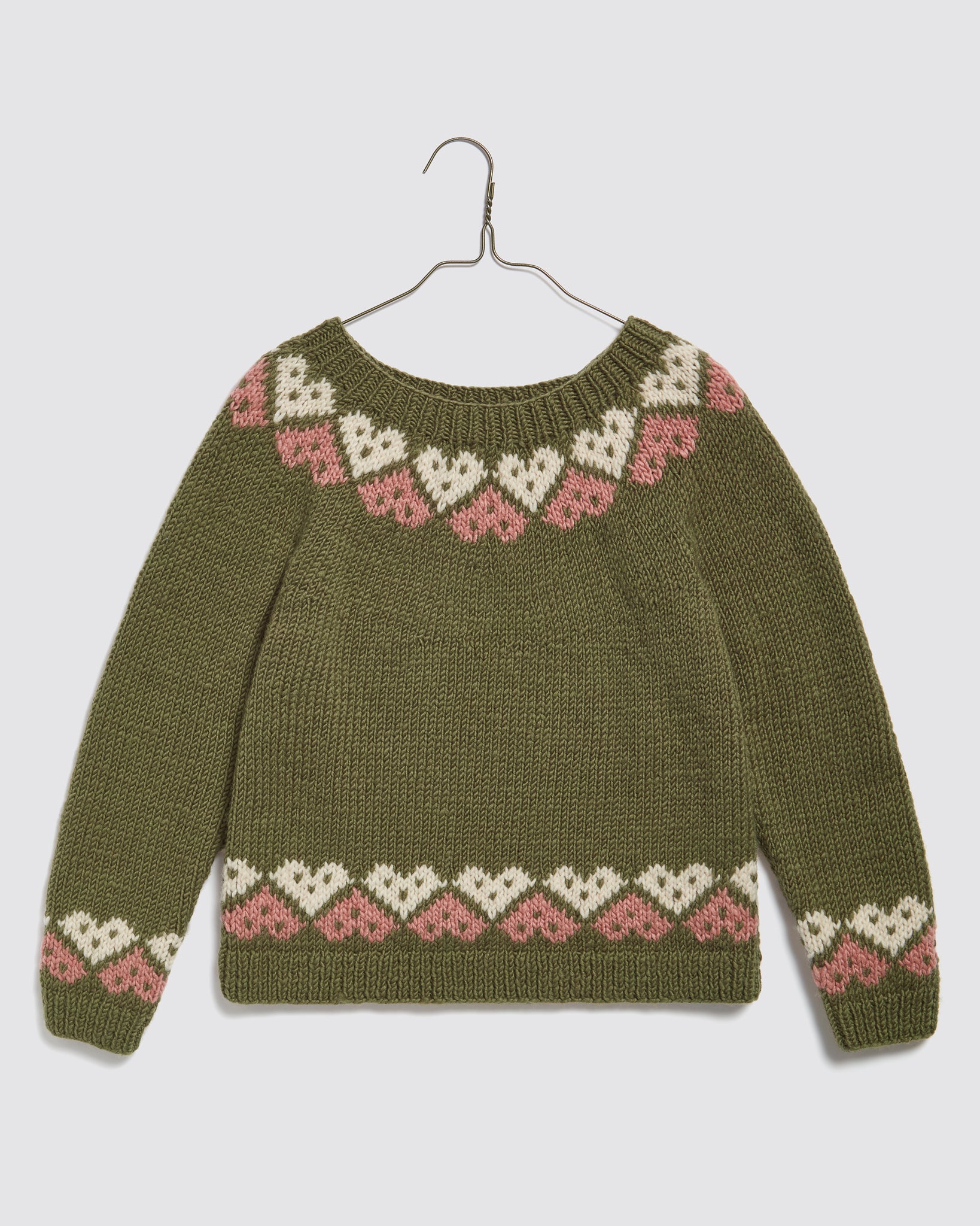 Hand-knitted kids jumper in multicolor Merino wool with heart pattern, featuring a vintage style and sustainable, ethically made natural materials for childhood comfort.
