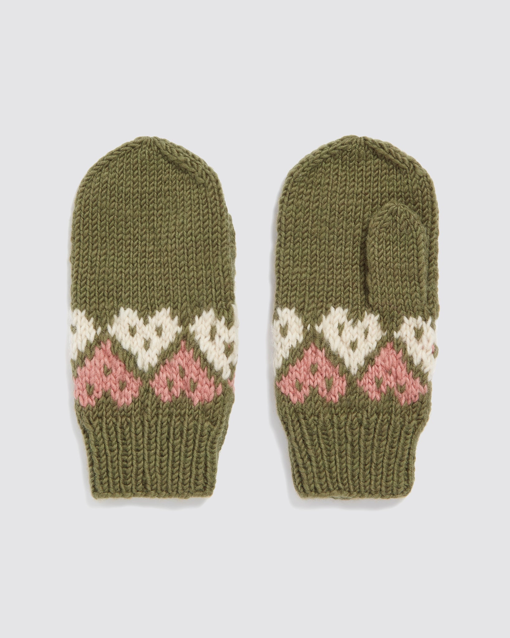 Pair of hand-knitted kids mittens in green merino wool featuring a vintage-style heart pattern in pink and white, crafted with organic, sustainable materials.