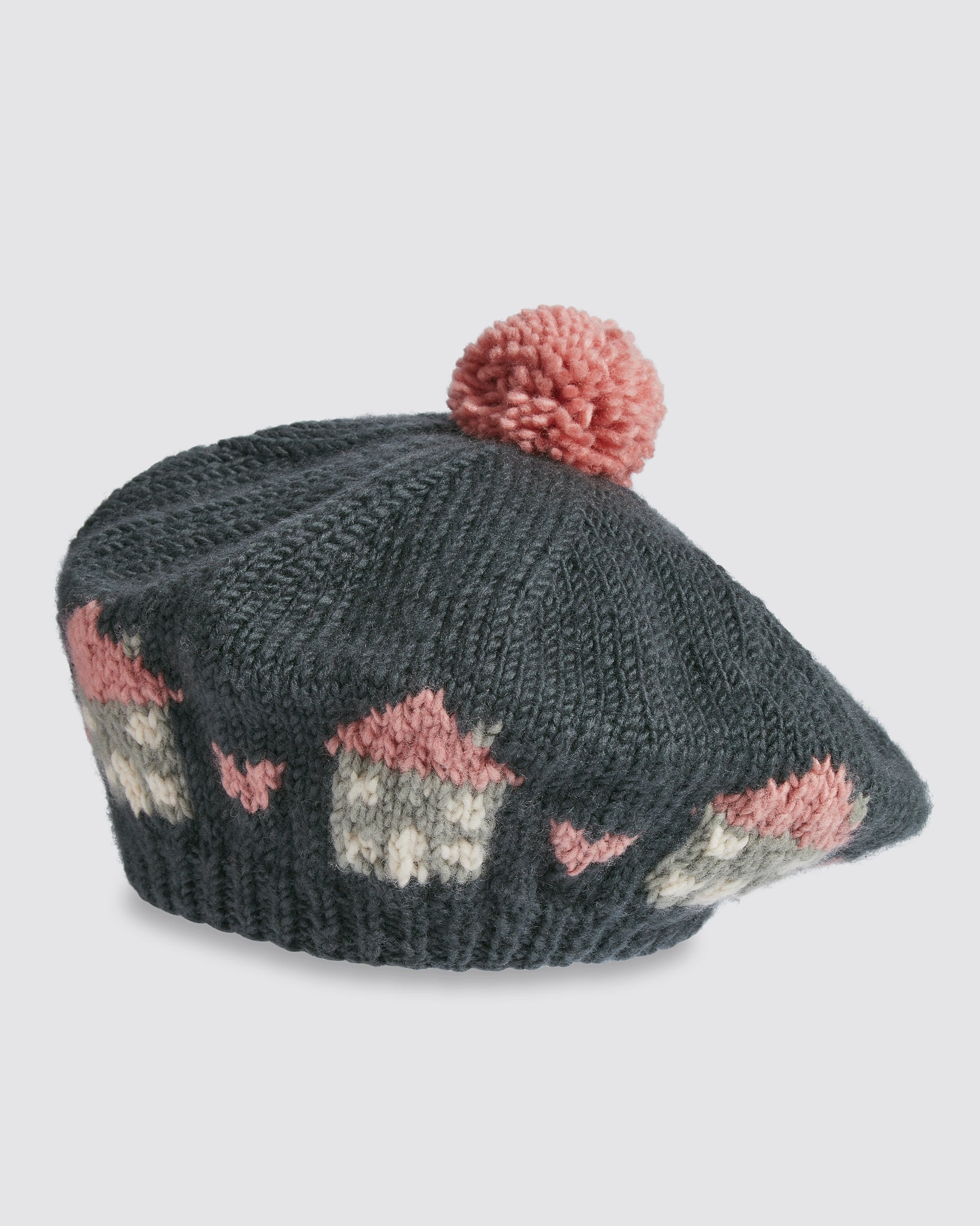 Multicolor hand-knitted merino beret for kids featuring a vintage-inspired cottage pattern and a soft pink pompom, crafted with care from natural materials.