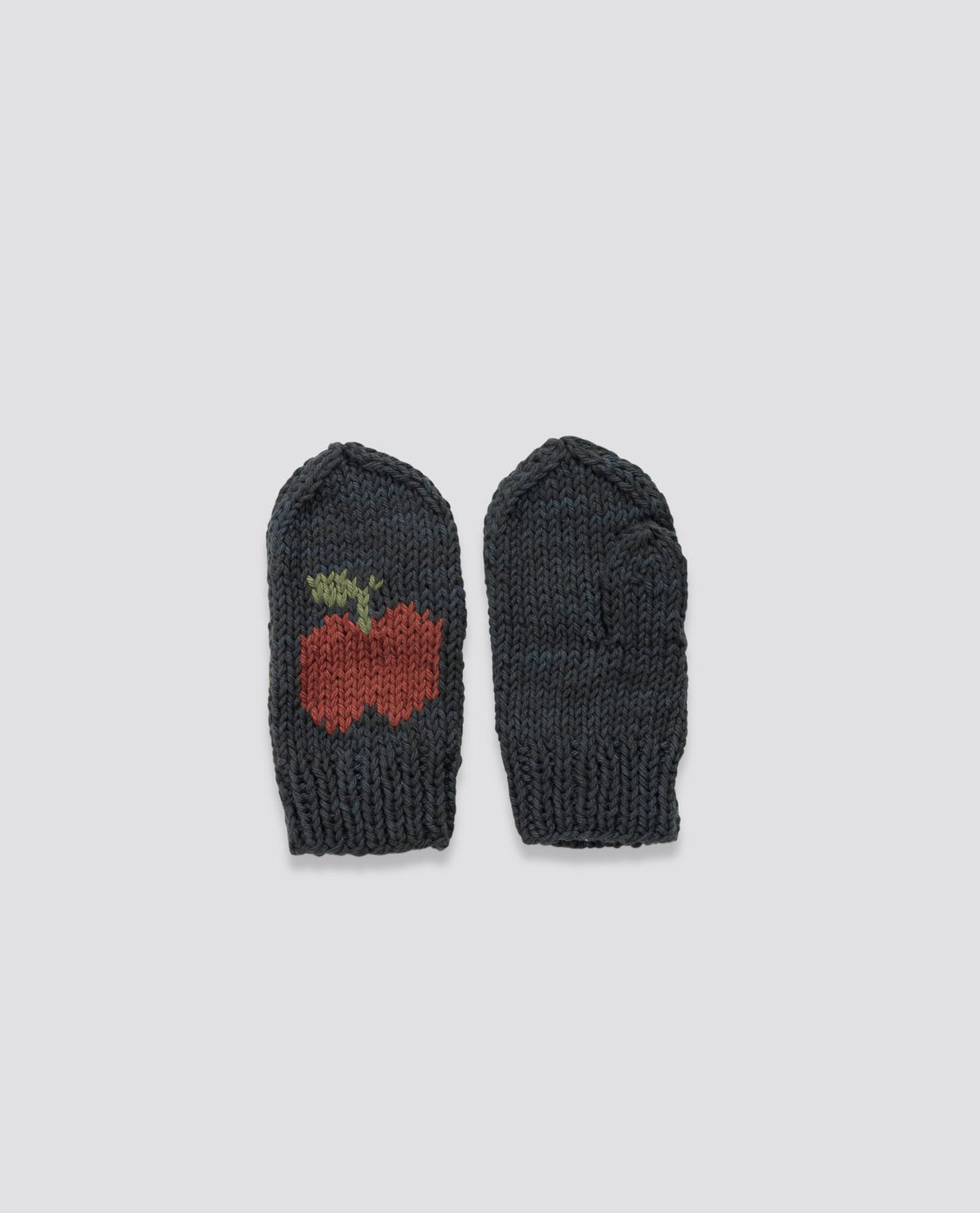 Hand knitted mittens with a timeless apple pattern, made from natural materials for ethical and sustainable children's style.