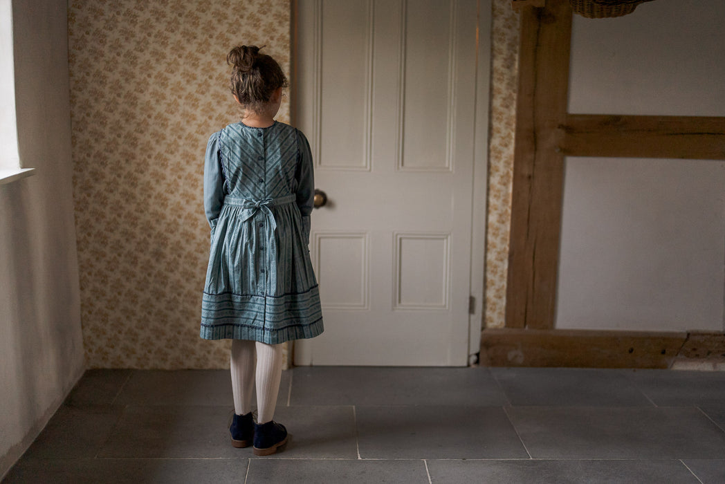 Vintage inspired, teal and blue organic floral pinafore dress with patch pockets and gathered crochet trims 9