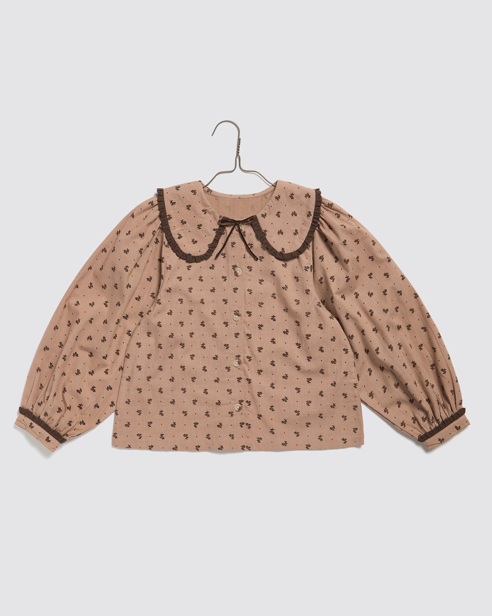 Beige floral girls blouse made from organic cotton with a vintage-inspired large collar and button front, designed for sustainable and ethical kids clothing.