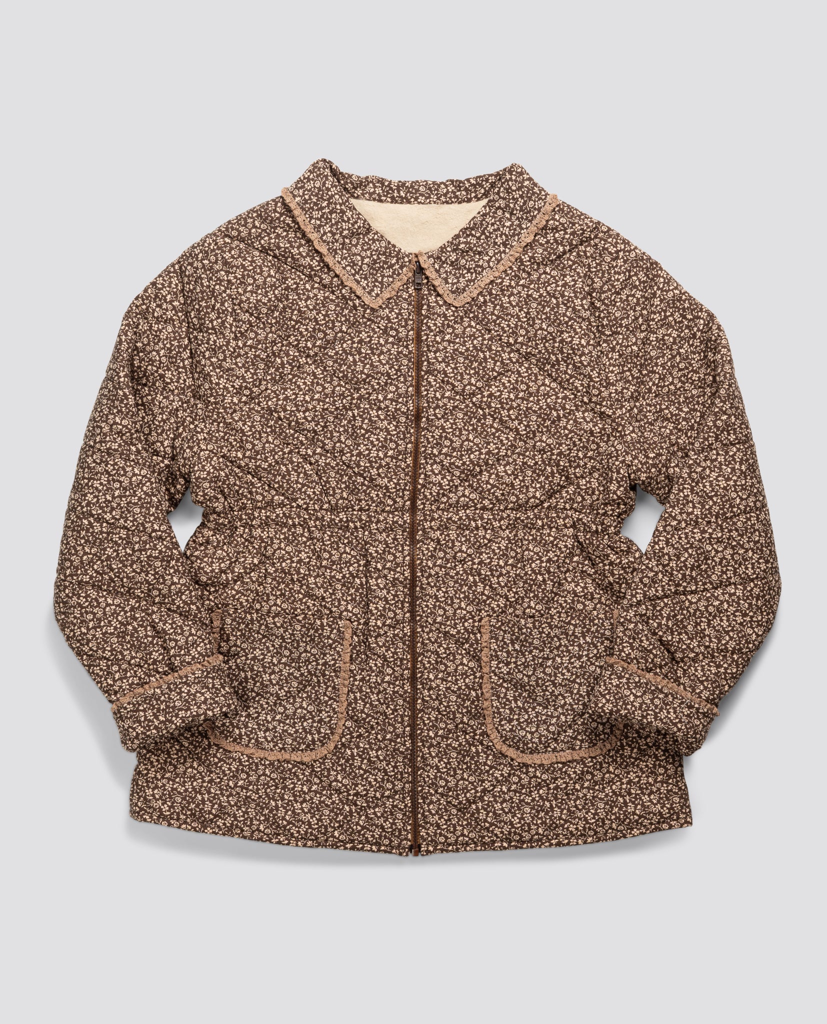 Brown and beige floral jacket for adults made from organic cotton, featuring a vintage-inspired design with a soft collar and front pockets, crafted sustainably and ethically.