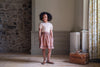 Pointelle jersey, floral t-shirt with pretty pink floral print, worn with tea rose check Margot skirt with pockets and ric-rac trim. 