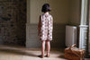 Hannah organic cotton, A-line dress with buttons to the back. Contrasting cotton button placket detail.