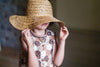 the contrasting trims of the dress can be found at the neck edge, hem and pockets. This pink and brown patchwork girls dress is perfect for summer.