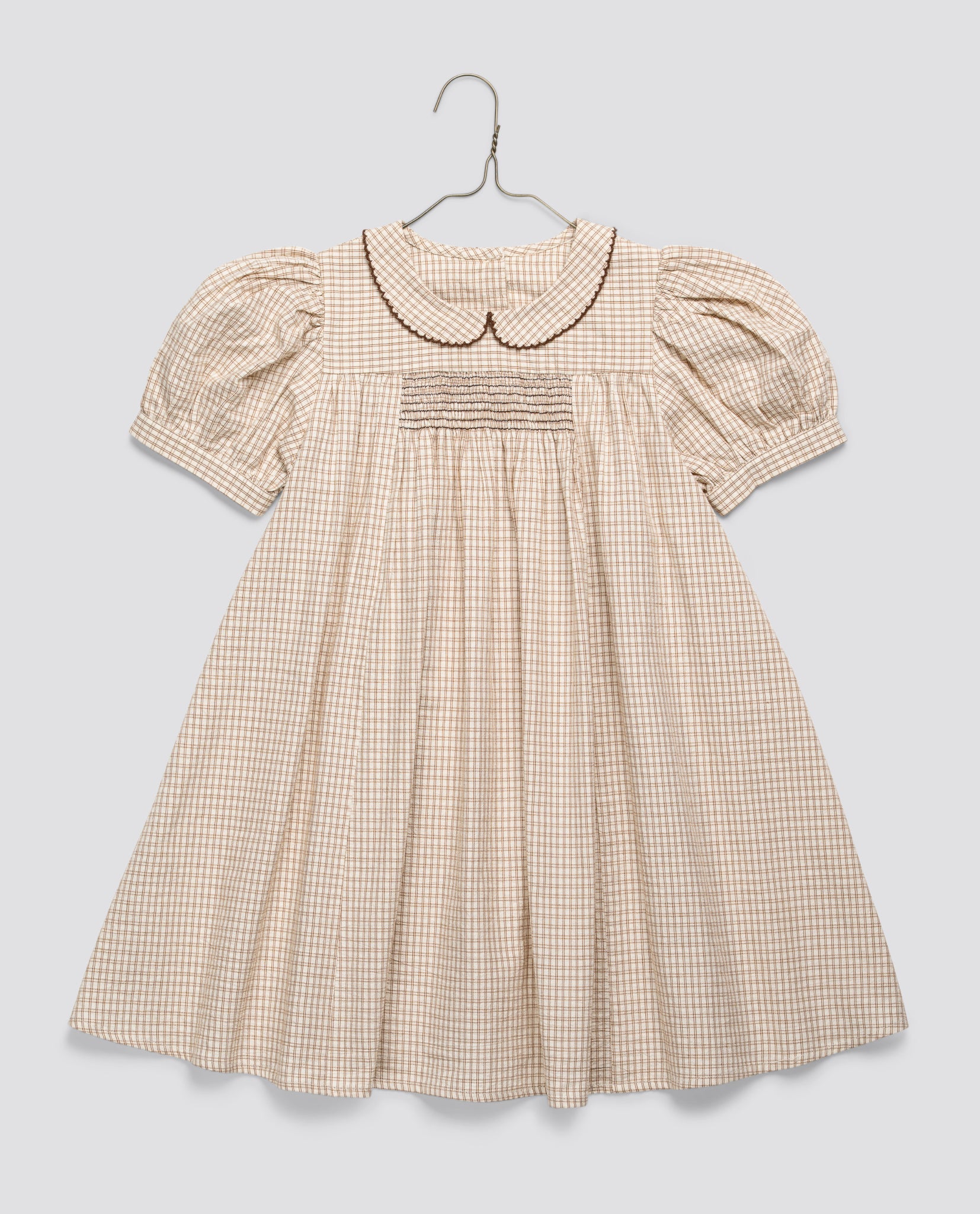 Vintage style girls dress in soft checkered yellow cotton blend with puff sleeves and a peter pan collar, designed for toddlers and ethically made with natural materials.
