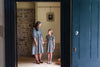 Full ladies boho style summer smock dress in block print inspired floral with full flowing skirt and billowing sleeves.  Perfect for everyday and special occasions and comes with matching girls dress for little me twinning.   Image  shows Mum and Daughter matching dresses. 