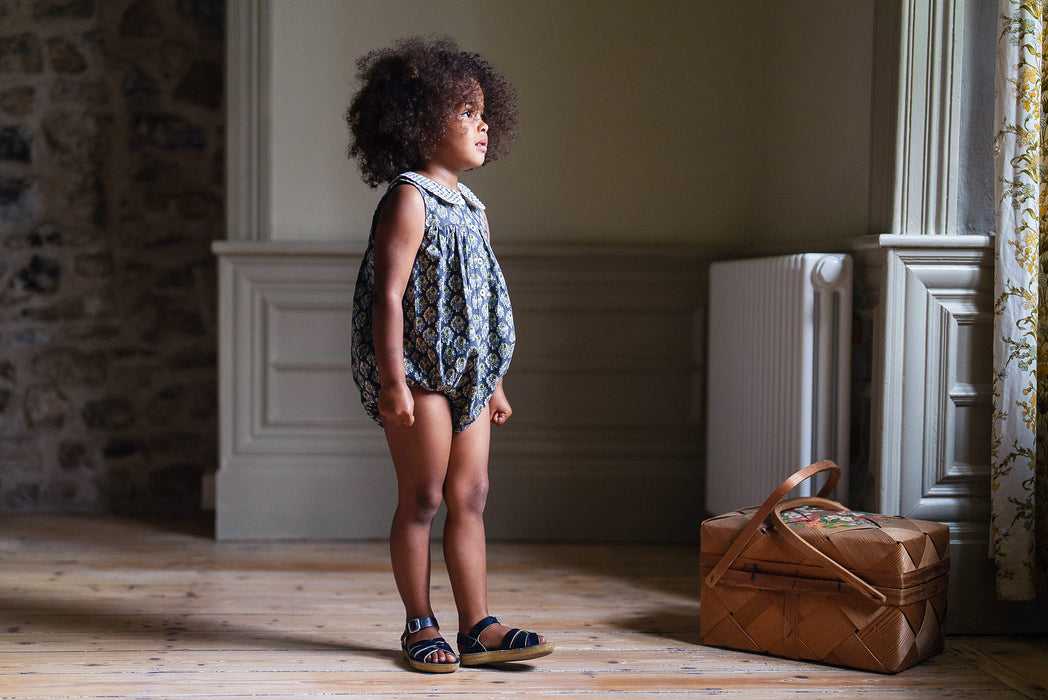 Girls block print inspired, blue floral romper with peter pan collar in checked fabric. Made in beautiful organic floral fabric.