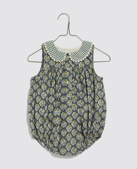 Vintage style girls romper all-in-one made in blue floral, organic cotton. Contrasting peter-pan collar with cotton ric-rac trim. 