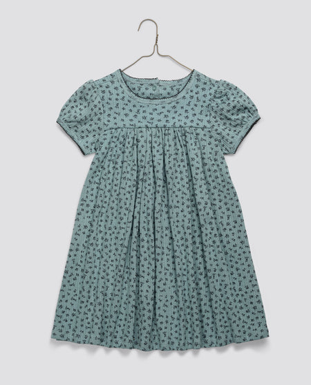 Blue floral vintage style girls dress made from organic jersey cotton with delicate pointelle detailing, designed ethically for sustainable children's clothing.