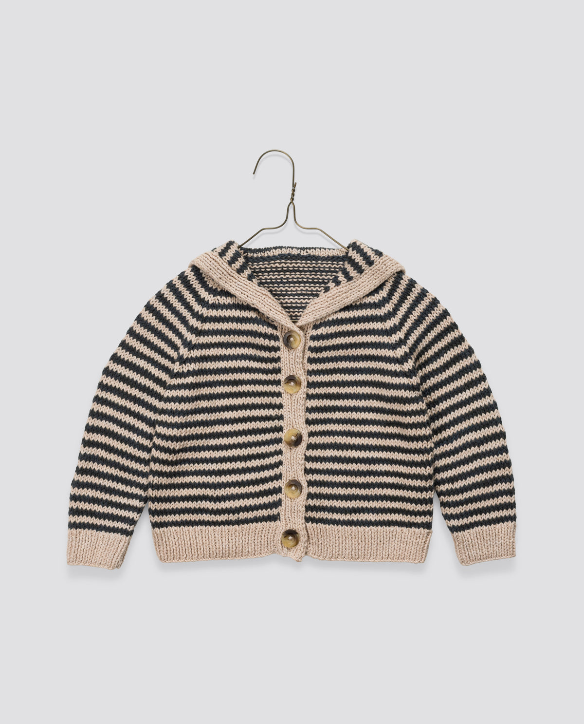 Cream and black striped hand knitted cardigan with charming sailor collar, vintage-inspired and ethically made for sustainable children's clothing.