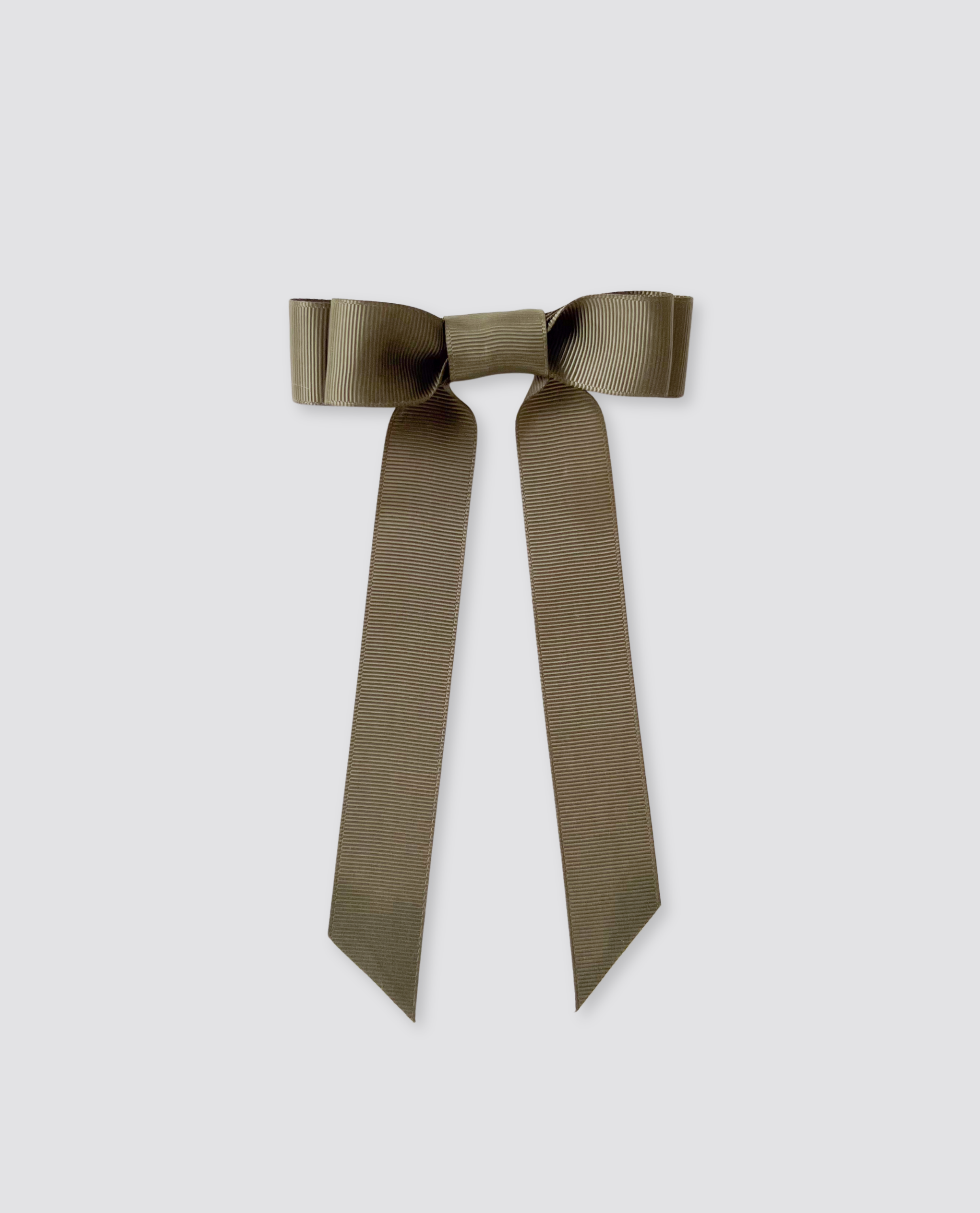 Olive green grosgrain hair bow with long tails, designed for kids and adults, reflecting a vintage style with an ethical, sustainable approach.