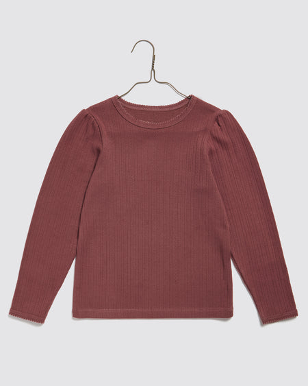 Organic, pointelle jersey, long sleeved girls t-shirt in red pink. Round neck, slim fitting gathered sleeve heads. 100% organic cotton plain t shirt.