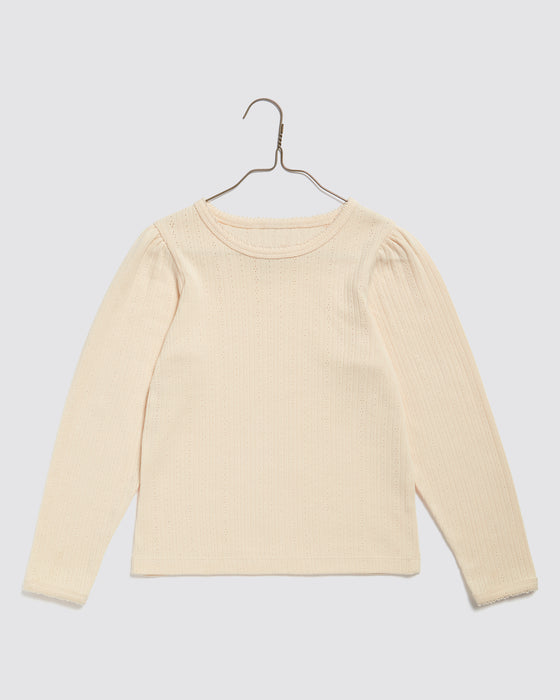 Organic pointelle jersey long sleeved t shirt in cream. Round neck, slim fitting gathered sleeve heads. 100% organic cotton plain t shirt.