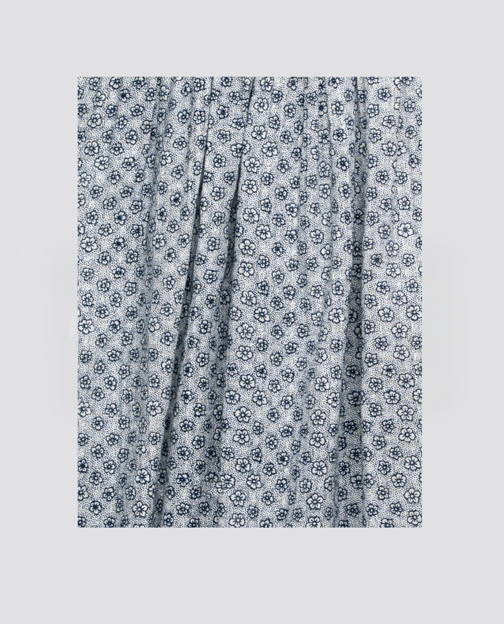 Blue organic cotton fabric with a delicate floral vintage-style pattern, perfect for sustainable children's clothing and ethical dress making projects