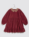 Red velvet Christmas holiday dress for girls. This dress has a peter pan lace collar, long sleeves and a prairie frill. 100% cotton velvet.