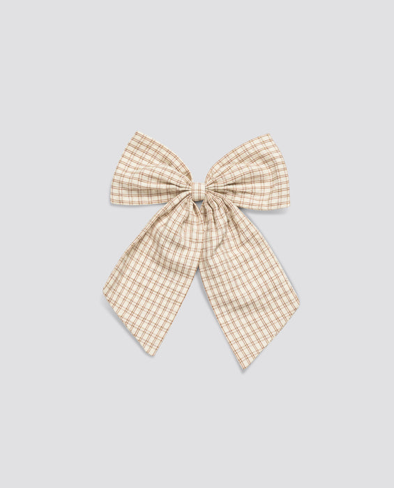 Soft vintage-style bow with elastic, made from natural cotton in a delicate straw check pattern, perfect for ethical children's clothing.