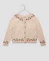 Cream hand-knitted children's cardigan with cherry pattern details in soft cotton, featuring vintage style and sustainable, ethically made design for girls.