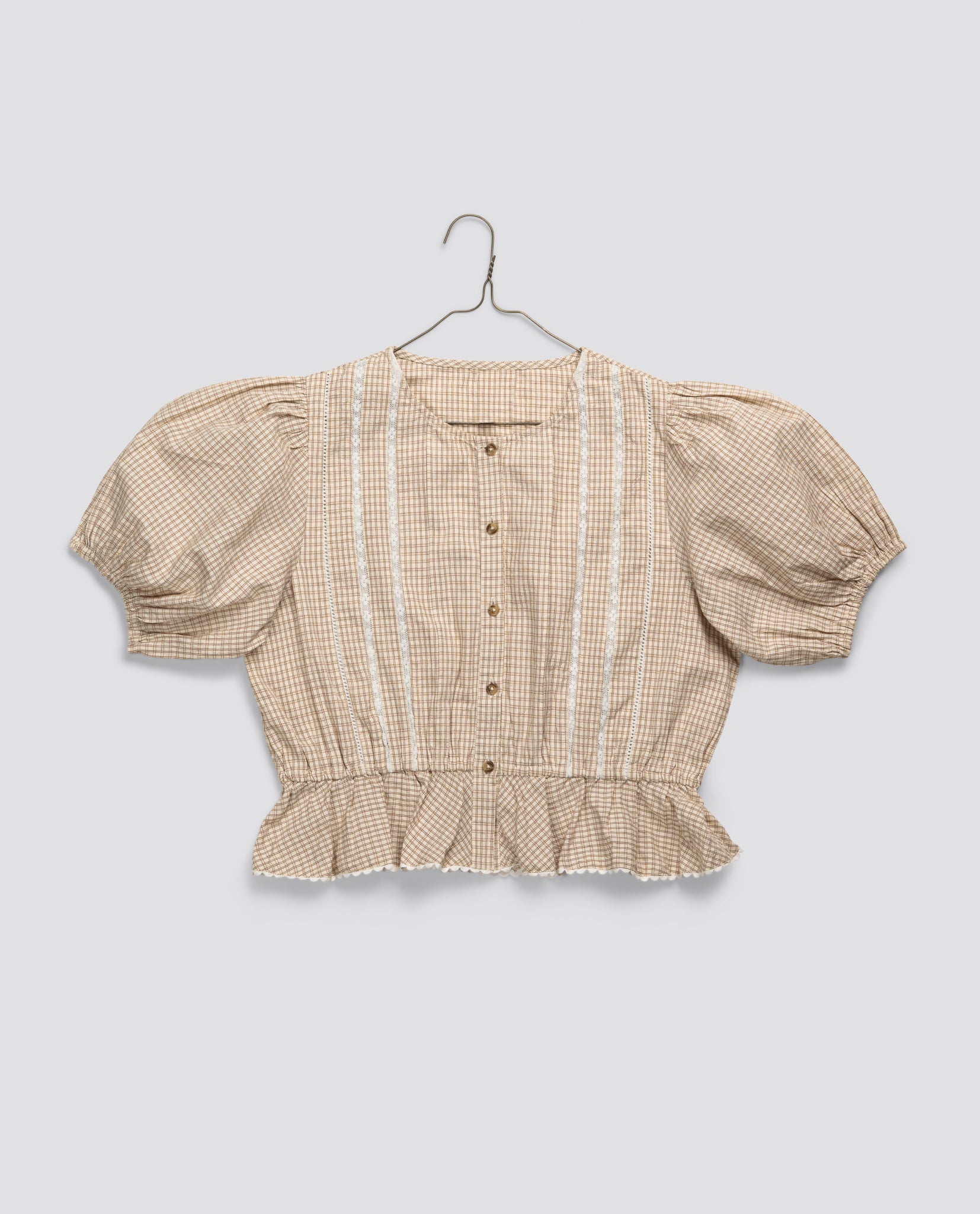 Vintage style girls blouse in soft straw check pattern, made from organic cotton with puff sleeves and delicate lace details, perfect for ethical and sustainable children's clothing.
