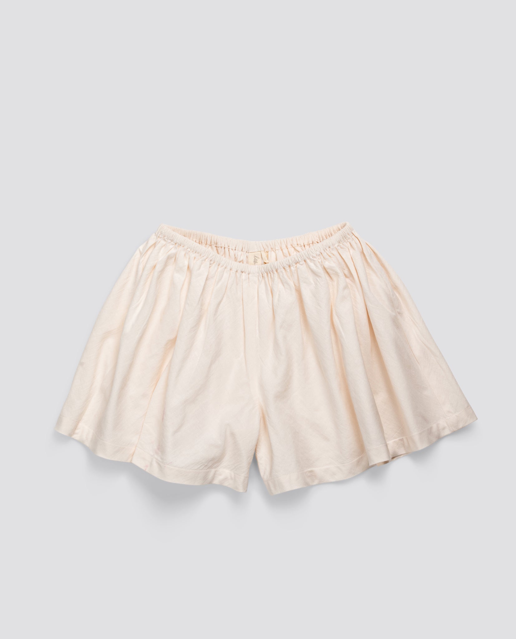 Cream-colored culottes for children made from organic cotton, featuring a soft, vintage-inspired style perfect for sustainable, ethical kids' clothing.