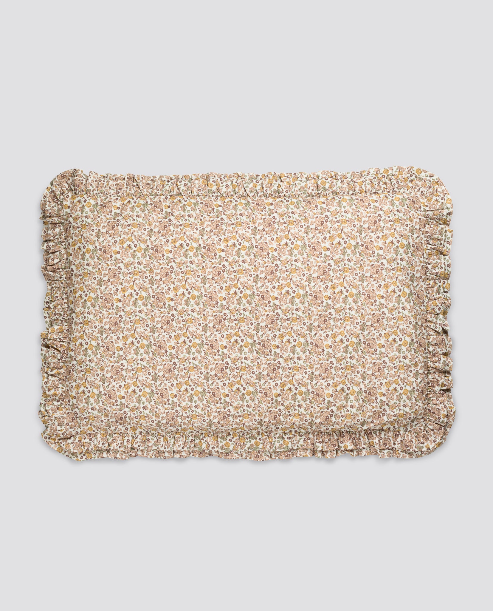 Soft pillowcase featuring a delicate yarrow floral pattern in vintage-inspired natural tones, made from organic cotton with gentle ruffled edges.