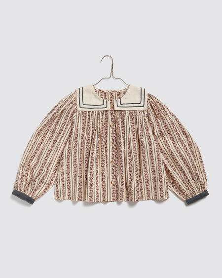 Girls sailor blouse made in floral organic cotton. Blue striped floral with white sailor collar and blue velvet cuffs. 100% organic cotton with vintage inspired striped floral print. Sustainable and ethical kids clothing.