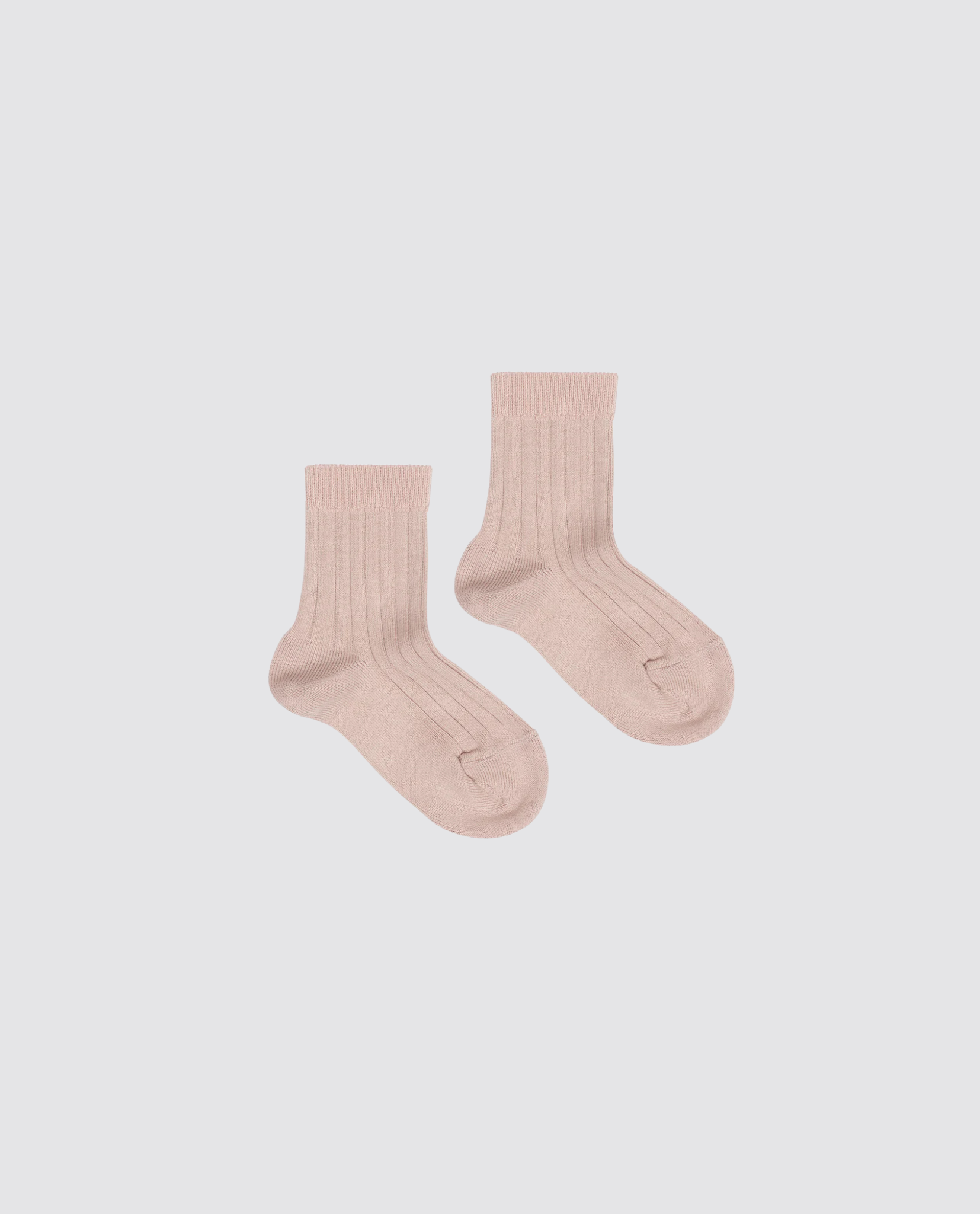 Pair of ribbed ankle socks in soft beige cotton blend, designed for children with a vintage-inspired, sustainable, and ethically made focus on natural materials.