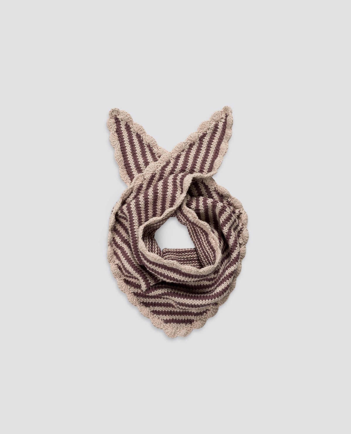 Soft cream and red cotton scarf with hand-knitted stripe detailing, crafted sustainably for children's clothing.