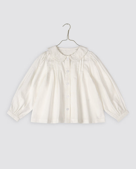 White, long-sleeved organic cotton girls Blouse with an embroidered Peter Pan collar, pin tucks at the shoulders, and a button cuff. vintage inspired and sustainably made.